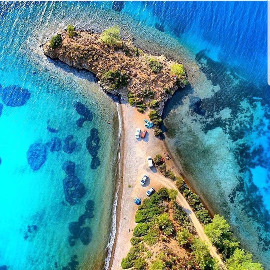Aktur Cove, pine hills and clear blue water